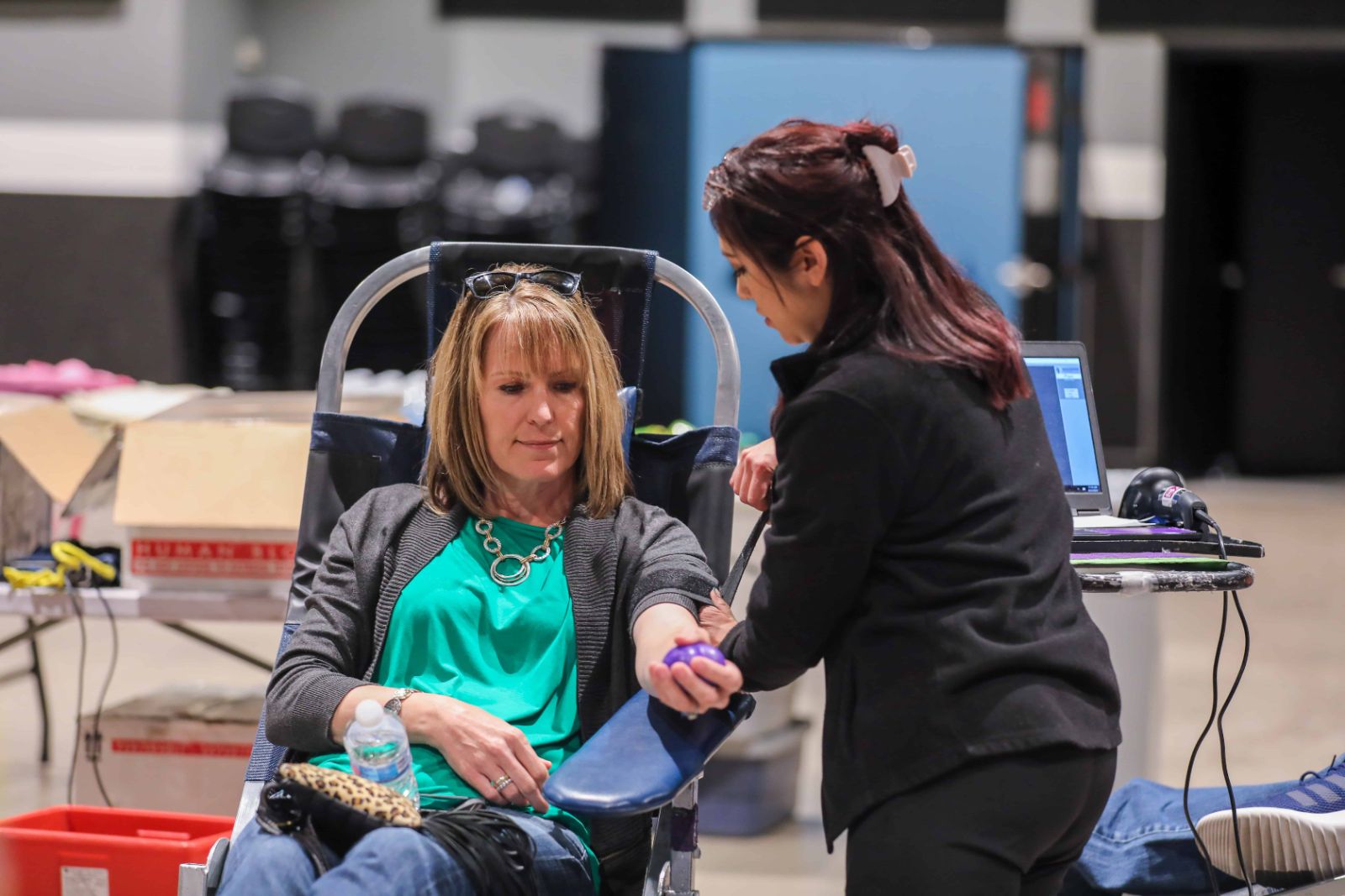 Woman donating blood at a Legacy Church blood drive