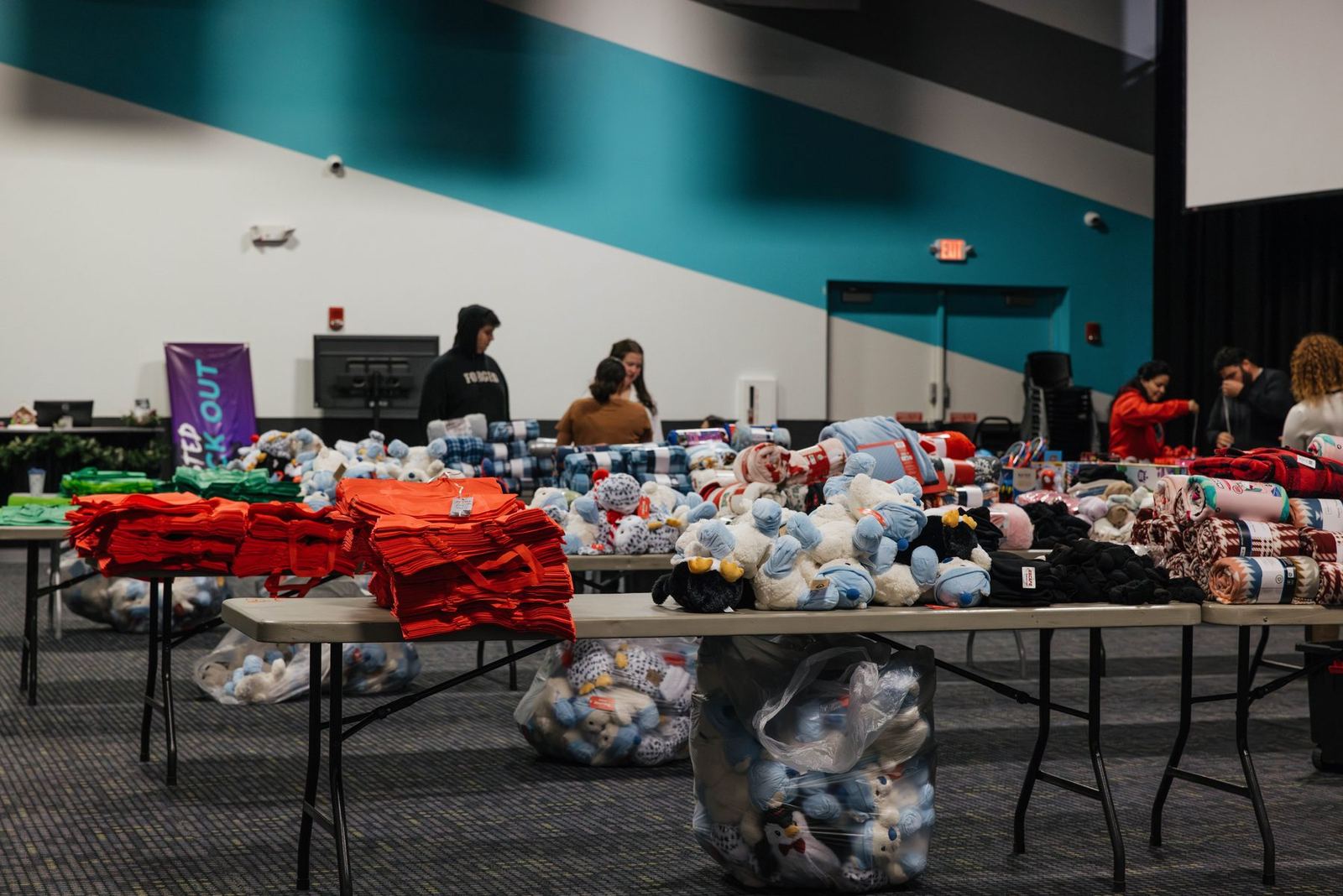 Tables of donated Christmas gifts for kids