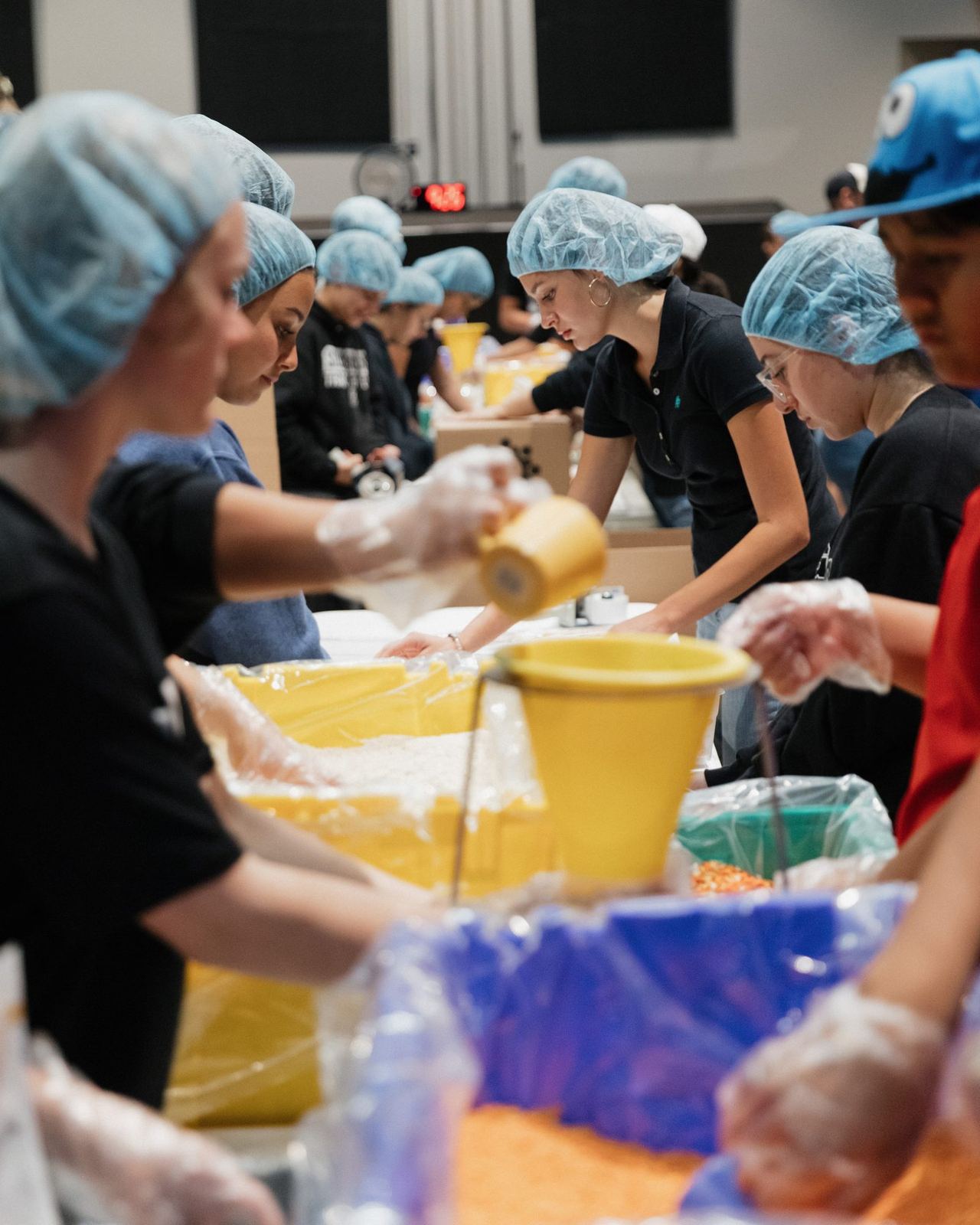 Legacy Academy students packing meals