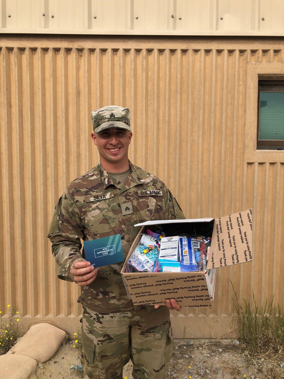 Soldier holding a Legacy Church care package