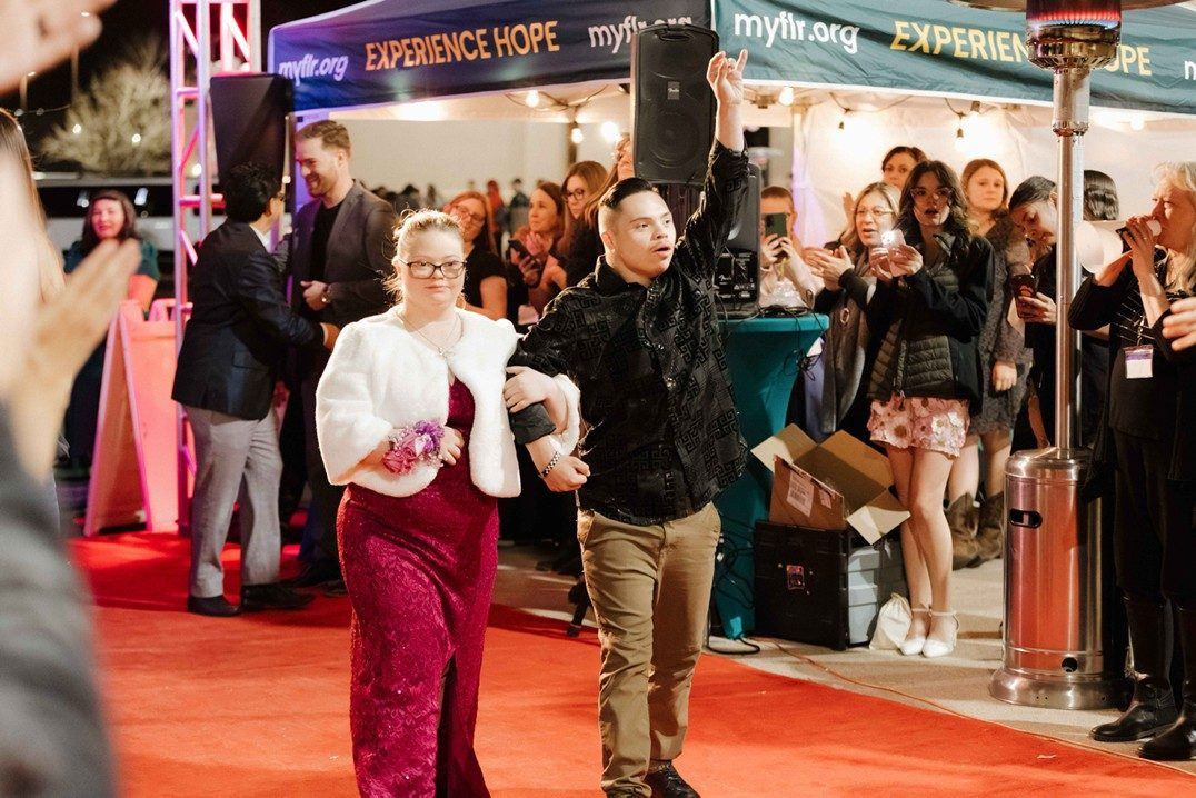 Guests walking the red carpet at Night to Shine