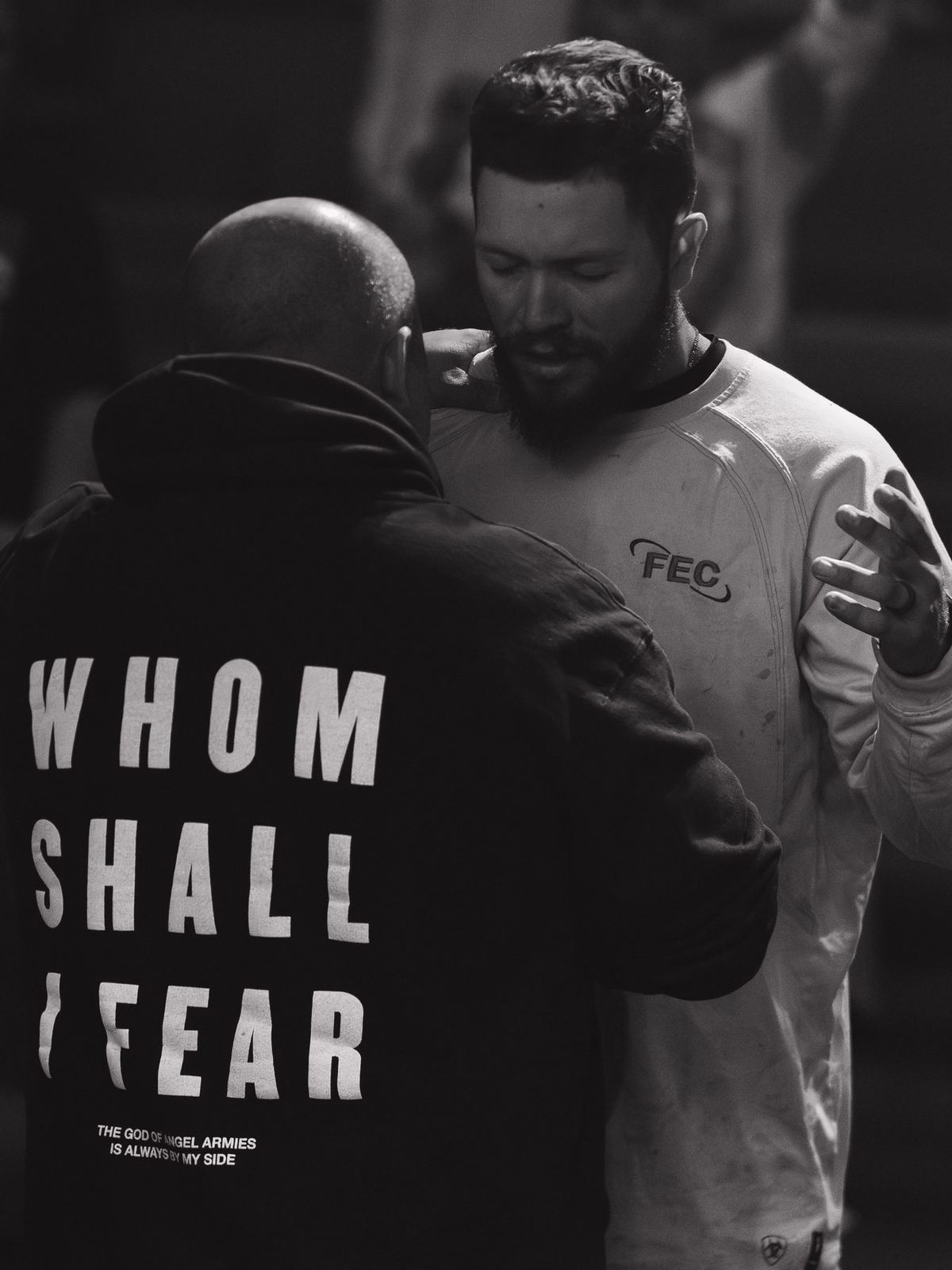 Men praying together at Legacy Church